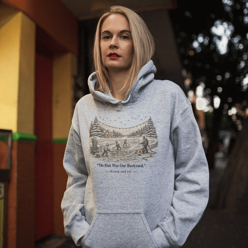 The Rink Was Our Backyard Hoodie – nostalgic outdoor hockey sweatshirt inspired by backyard rink memories. Unisex fit. Multiple colors available.