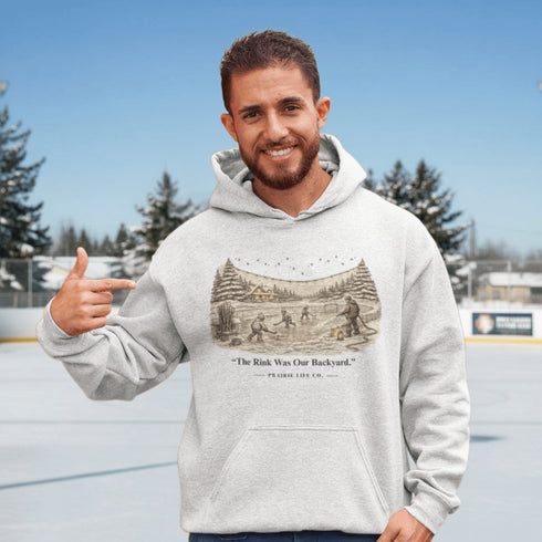 The Rink Was Our Backyard Hoodie – nostalgic outdoor hockey sweatshirt inspired by backyard rink memories. Unisex fit. Multiple colors available.