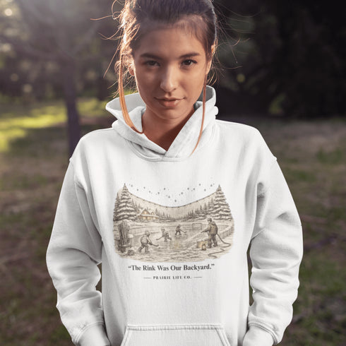 The Rink Was Our Backyard Hoodie – nostalgic outdoor hockey sweatshirt inspired by backyard rink memories. Unisex fit. Multiple colors available.
