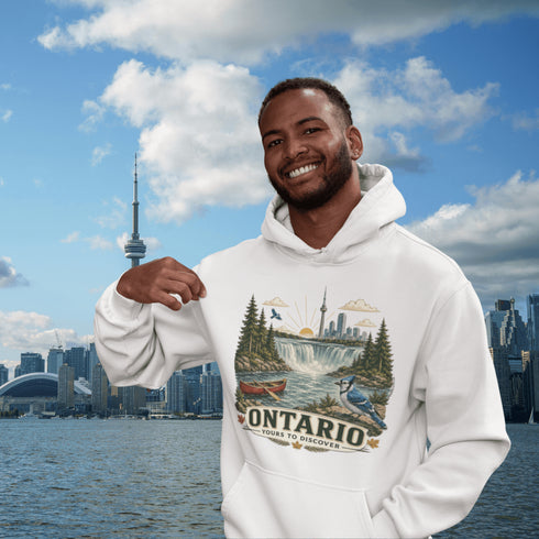 Man wearing a hoodie with Ontario-themed design in front of a city skyline and water body.