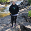 This trendy hoodie features a nature footprint logo with the words C & Win Sports, Proudly Canadian