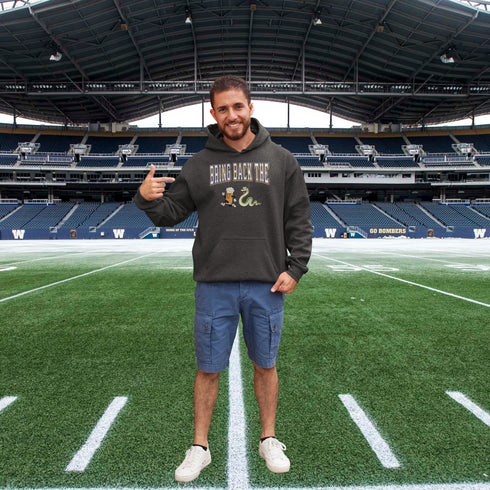 Introducing the "Bring Back The Beer Snake" Hoodie – the ultimate conversation starter (and possibly friendship saver) for every die-hard Winnipeg Bomber fan! This cozy, stylish hoodie features a hilarious graphic of a beer running away from a mischievous snake, perfectly capturing the epic saga of the legendary beer snake.