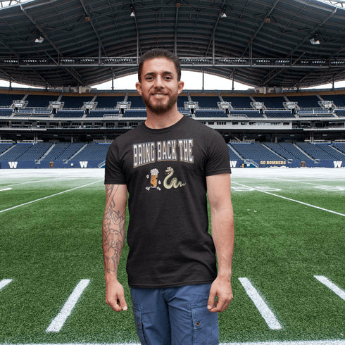 Introducing the "Bring Back The Beer Snake" T-shirt – the ultimate conversation starter (and possibly friendship saver) for every die-hard Winnipeg Bomber fan! This soft, stylish tee features a hilarious graphic of a beer running away from a mischievous snake, perfectly capturing the epic saga of the legendary beer snake.