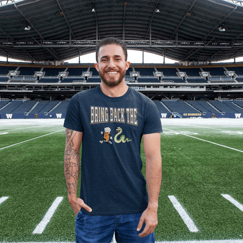 Introducing the "Bring Back The Beer Snake" T-shirt – the ultimate conversation starter (and possibly friendship saver) for every die-hard Winnipeg Bomber fan! This soft, stylish tee features a hilarious graphic of a beer running away from a mischievous snake, perfectly capturing the epic saga of the legendary beer snake.