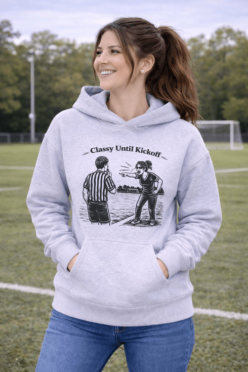 Funny soccer hoodie with “Classy Until Kickoff” text and illustration of woman yelling at referee on soccer field
