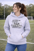 Soccer mom hoodie with “Running on Coffee and Game Day Chaos” design featuring moms cheering on the sidelines with kids playing soccer in the background