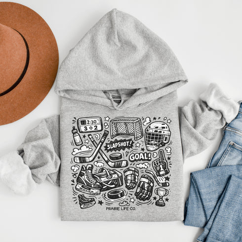 Celebrate your love of the game with this Vintage Hockey Doodle Hoodie featuring hockey sticks, skates, gloves, helmet, goal net and puck graphics. A cozy hoodie for hockey lovers, players, and hockey moms.