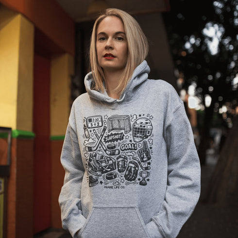 Celebrate your love of the game with this Vintage Hockey Doodle Hoodie featuring hockey sticks, skates, gloves, helmet, goal net and puck graphics. A cozy hoodie for hockey lovers, players, and hockey moms.