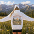 Vintage mountain and wildflower graphic hoodie featuring a matching left chest design and oversized back print on a unisex Gildan 18500 Heavy Blend hoodie available in multiple colors. Perfect for hiking, camping, outdoor adventures, and everyday wear.