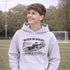 Boy wearing grey hoodie with “When In Doubt Punch It Out” soccer goalie design featuring diving goalkeeper making a save