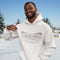Celebrate the magic of winter with our Winter Pond Hockey Hoodie. Featuring kids playing hockey on a frozen pond, a rustic barn, snowy trees – perfect for hockey moms, fans, and winter lovers.