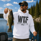 Unisex heavy blend hoodie featuring a humorous fishing graphic with hook and rod artwork displayed in a variety of outdoor lifestyle mockups and fishing-themed settings.
