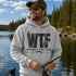 Unisex heavy blend hoodie featuring a humorous fishing graphic with hook and rod artwork displayed in a variety of outdoor lifestyle mockups and fishing-themed settings.