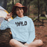 Step into the wild with our unique camping hoodie, featuring a captivating camping scene intricately etched inside the words "Into The Wild". Crafted for outdoor enthusiasts, this hoodie is not just a piece of clothing but a symbol of adventure and exploration.