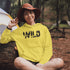 Step into the wild with our unique camping hoodie, featuring a captivating camping scene intricately etched inside the words "Into The Wild". Crafted for outdoor enthusiasts, this hoodie is not just a piece of clothing but a symbol of adventure and exploration.