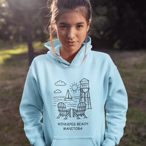 Cozy up in coastal charm with our Winnipeg Beach Doodle Hoodie, inspired by the laid-back vibe of one of Manitoba’s most beloved lakeside getaways.