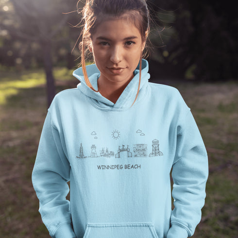 Show off your lake town pride with this cozy Winnipeg Beach Landmark Doodle Hoodie. Featuring a charming, hand-drawn skyline of iconic Winnipeg Beach sights.