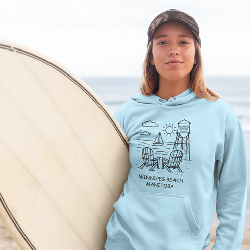 Cozy up in coastal charm with our Winnipeg Beach Doodle Hoodie, inspired by the laid-back vibe of one of Manitoba’s most beloved lakeside getaways.