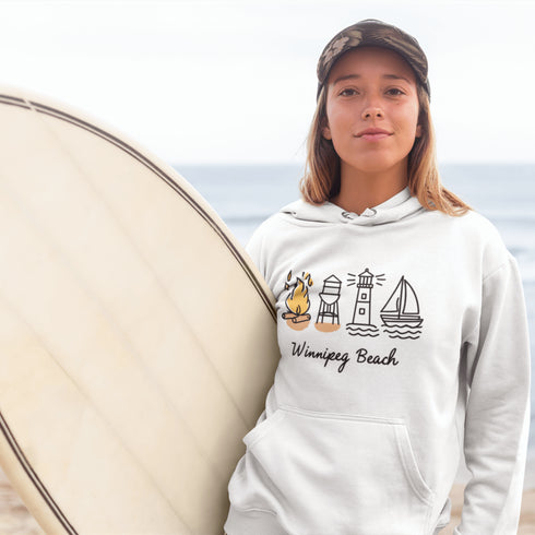 Cozy up in lakeside nostalgia with our Winnipeg Beach Doodle hoodie — a fun and playful tribute to one of Manitoba’s most beloved beach towns.