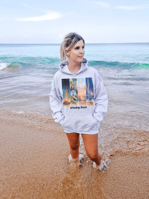 Inspired by the timeless charm of Winnipeg Beach, this cozy hoodie features a beautifully detailed watercolor collage capturing the spirit of this beloved lakeside destination.