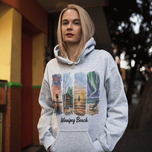 Bring the peaceful charm of Winnipeg Beach with you wherever you go. This soft, comfortable hoodie features a watercolor-style collage celebrating the beauty of Manitoba’s cherished lakeside town.