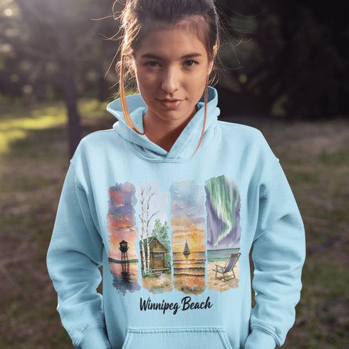 Bring the peaceful charm of Winnipeg Beach with you wherever you go. This soft, comfortable hoodie features a watercolor-style collage celebrating the beauty of Manitoba’s cherished lakeside town.