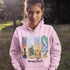 Bring the peaceful charm of Winnipeg Beach with you wherever you go. This soft, comfortable hoodie features a watercolor-style collage celebrating the beauty of Manitoba’s cherished lakeside town.