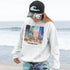 Inspired by the timeless charm of Winnipeg Beach, this cozy hoodie features a beautifully detailed watercolor collage capturing the spirit of this beloved lakeside destination.