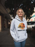 Introducing the "Winnipeg Beach Sunset Hoodie" – because nothing says relaxation like a sunset and a water tower! Whether you're reminiscing about lazy beach days or just need an excuse to wear something cozy, this hoodie captures all the magic of Winnipeg Beach.