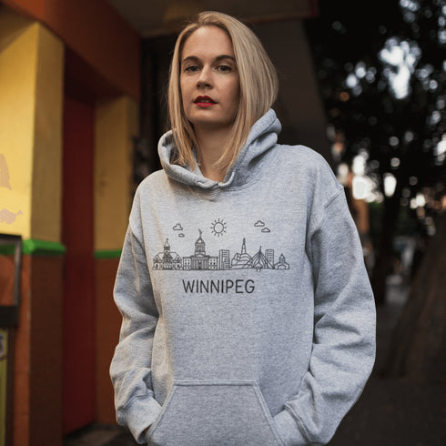 Show your city pride in style with our Winnipeg Doodle Art hoodie — a cozy tribute to the heart of Manitoba, wrapped in minimalist charm.