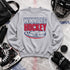 Winnipeg Hockey unisex crewneck sweatshirt featuring vintage navy and red collegiate lettering with a hockey puck graphic, designed by Prairie Life Co.