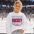 Winnipeg Hockey unisex crewneck sweatshirt featuring vintage navy and red collegiate lettering with a hockey puck graphic, designed by Prairie Life Co.