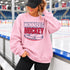 Winnipeg Hockey unisex crewneck sweatshirt featuring vintage navy and red collegiate lettering with a hockey puck graphic, designed by Prairie Life Co.