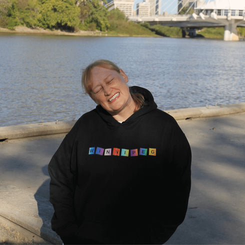 Whether you’re spelling out your love for the city or just trying to score major style points, this hoodie has you covered. Featuring colorful Scrabble tiles that spell "Winnipeg," it's the perfect choice for anyone who loves the Peg and appreciates a good word game.