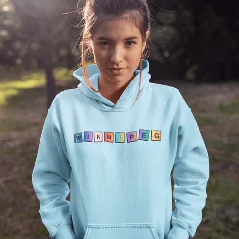 Whether you’re spelling out your love for the city or just trying to score major style points, this hoodie has you covered. Featuring colorful Scrabble tiles that spell "Winnipeg," it's the perfect choice for anyone who loves the Peg and appreciates a good word game.