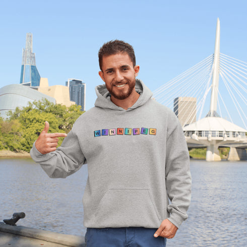 Whether you’re spelling out your love for the city or just trying to score major style points, this hoodie has you covered. Featuring colorful Scrabble tiles that spell "Winnipeg," it's the perfect choice for anyone who loves the Peg and appreciates a good word game.