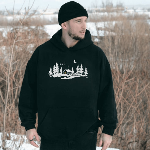 Wrap yourself in winter wonder with our Snowy Cabin Hoodie — a cozy escape you can wear.