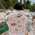 This cozy hoodie brings the wonders of the woods to life, with an intricate scene of woodland animals like foxes, bears, and rabbits illustrated on the back, creating a vibrant forest landscape you can carry with you.