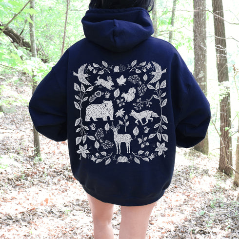 Featuring a collage of woodland animals on the back, this design captures the essence of nature's charm with creatures like foxes, bears and squirrels nestled among lush foliage.