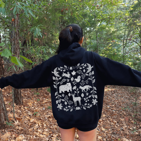 Featuring a collage of woodland animals on the back, this design captures the essence of nature's charm with creatures like foxes, bears and squirrels nestled among lush foliage.