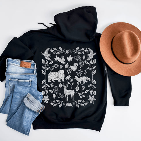 Featuring a collage of woodland animals on the back, this design captures the essence of nature's charm with creatures like foxes, bears and squirrels nestled among lush foliage.