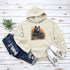 Featuring a detailed graphic of a black bear nestled comfortably among a colorful bed of autumn leaves, this hoodie brings warmth and woodland charm to your wardrobe.