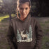 This hoodie features a beautifully crafted design of a majestic deer standing amidst the forest, capturing the quiet elegance of the woods.