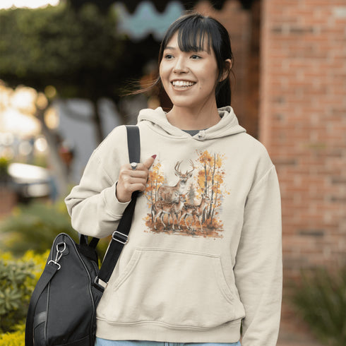 Step into the heart of fall with our Woodland Deer Hoodie, featuring a tender scene of a father deer with his two fawns in a peaceful autumn forest.