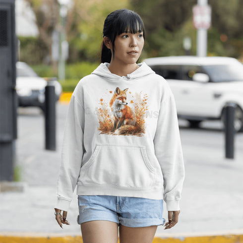 This hoodie features a striking image of a red fox standing alert and proud in its natural habitat, surrounded by lush foliage and the earthy colors of the wilderness.