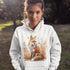 This hoodie features a striking image of a red fox standing alert and proud in its natural habitat, surrounded by lush foliage and the earthy colors of the wilderness.