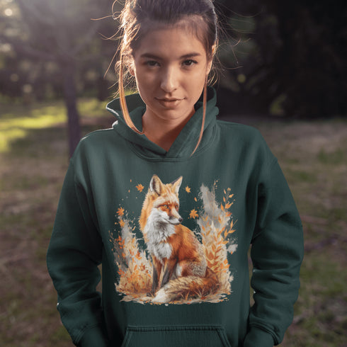 This hoodie features a striking image of a red fox standing alert and proud in its natural habitat, surrounded by lush foliage and the earthy colors of the wilderness.