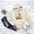 This cozy hoodie features a playful rabbit nestled among vibrant fall foliage, surrounded by the warm oranges, reds, and yellows of the season.