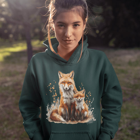 This beautifully crafted hoodie showcases a loving mother fox and her playful kit sitting in a cozy bed of fall foliage, surrounded by vibrant autumn leaves.