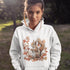 Get ready for fall with the Acorn Gatherer Hoodie, featuring an adorable squirrel surrounded by autumn foliage and a stash of acorns.